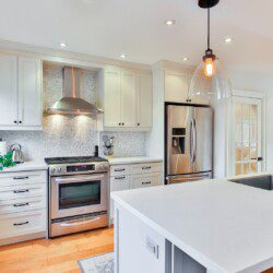 white wooden kitchen cabinet and white kitchen counter